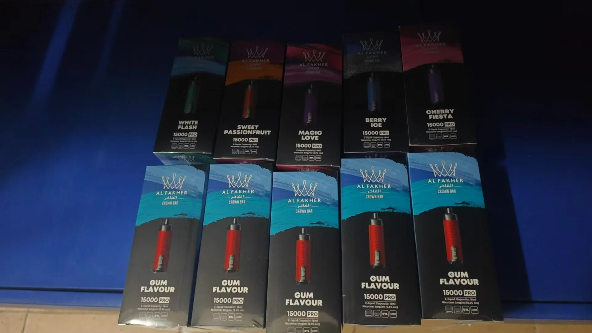 A selection of Al Fakher vapes on a clean background