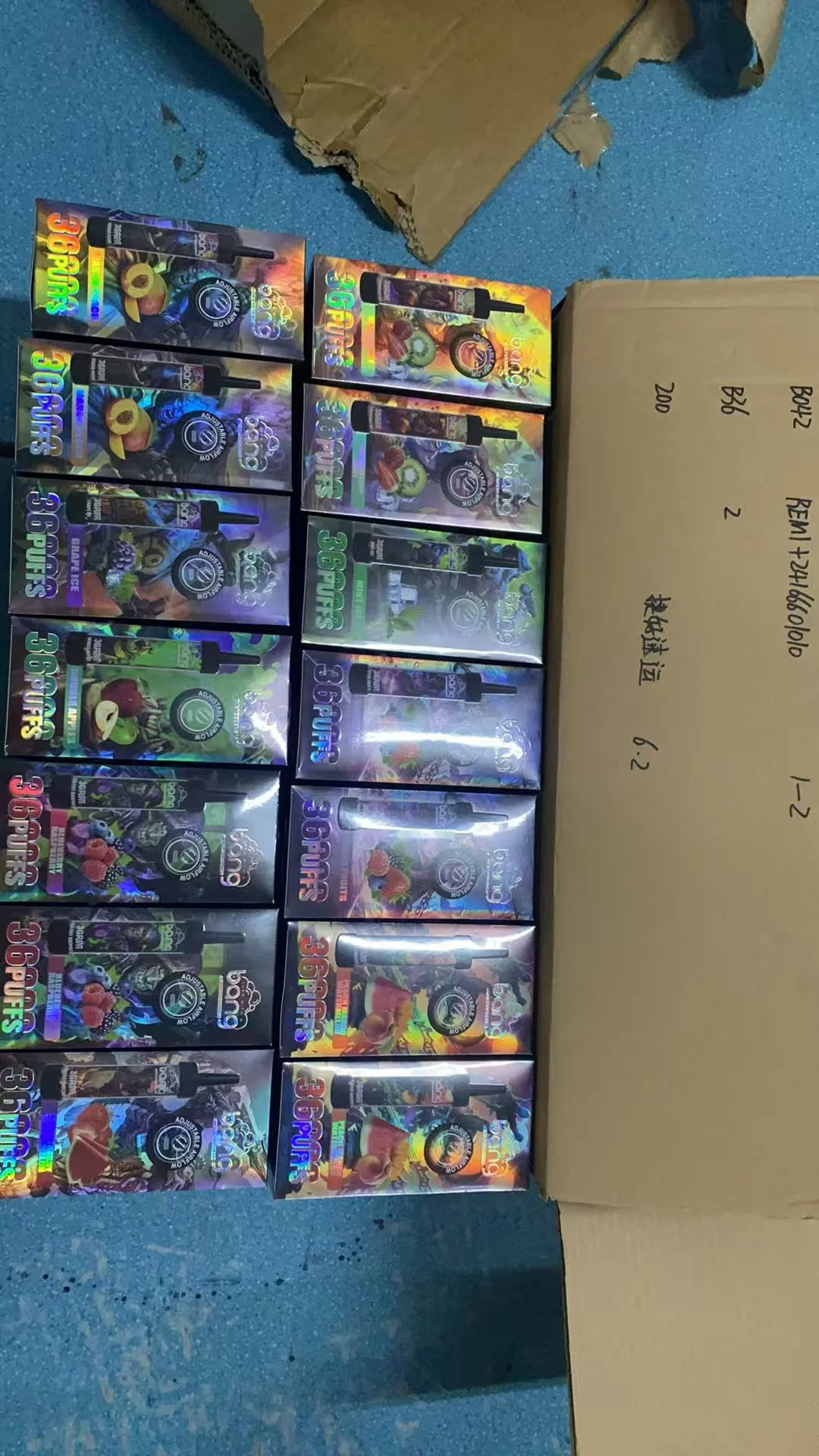 A worried business owner looking at boxes of stock