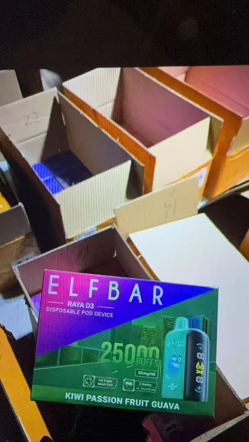 Elfbar Raya D3 disposable pod device packaging in Kiwi Passion Fruit Guava flavor on a background of open cardboard boxes.