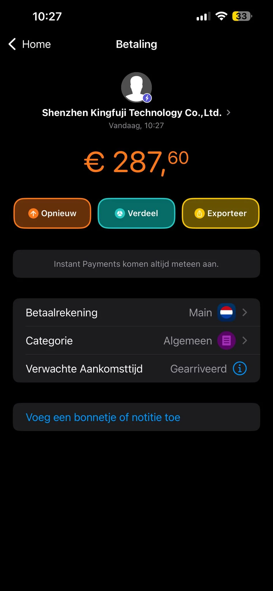 A person counting money next to a small stack of boxes