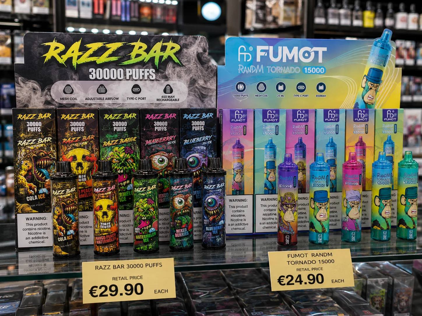 A store display featuring Razz Bar 30000 puffs and Fumot RandM Tornado 15000 puffs disposable vapes in various flavors. Pricing labels visible.