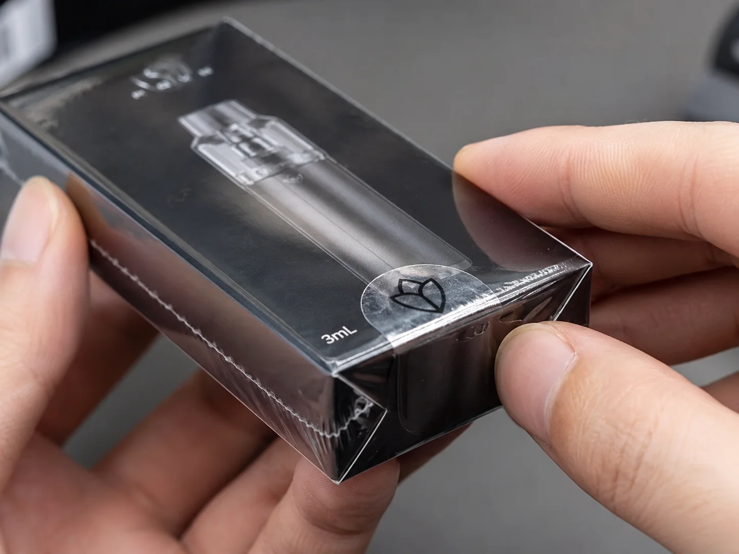 Inspecting the shrink wrap and seal on a product box